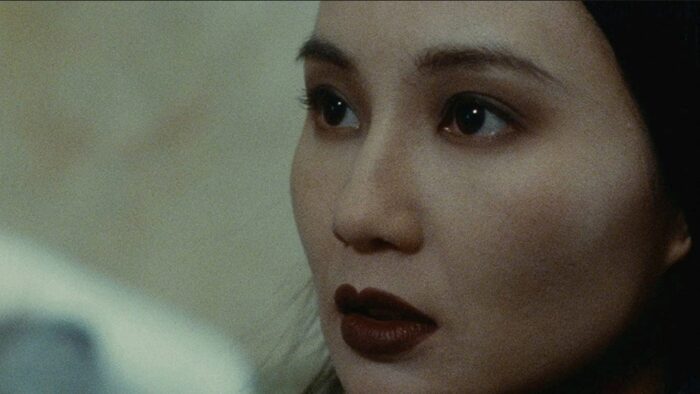 A close-up shot of Maggie Cheung's face