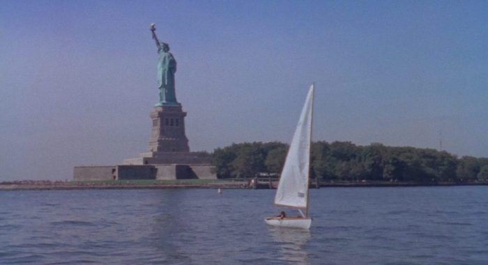 Still from Me the Terrible. A small sail boat sails in front of the Statue of Liberty in New York Harbor. Short added to the Criterion Channel May 2021