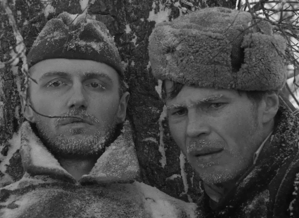 Two Russan soldiers face the camera, their eyelids and facial hair covered in frost in this image from The Ascent.