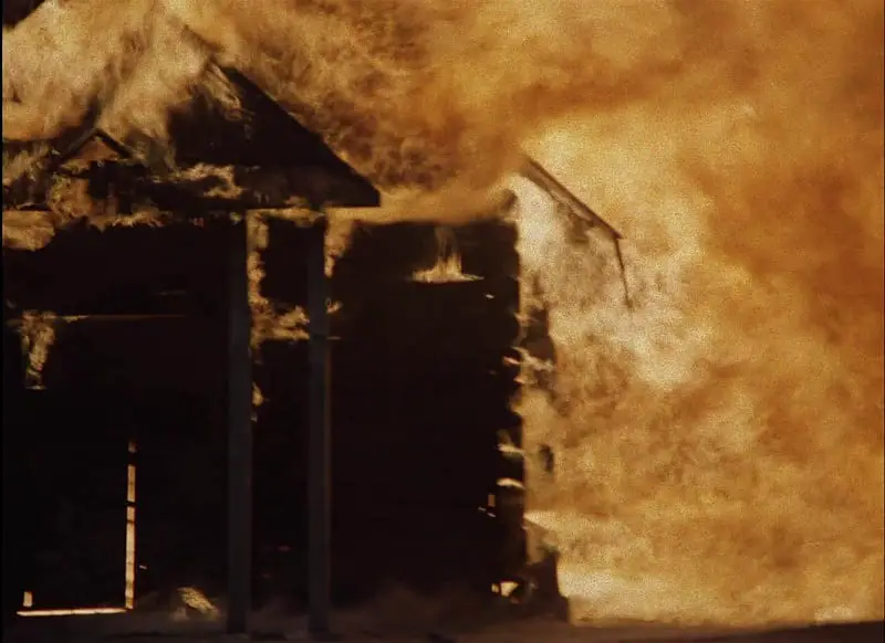In this image from Come and See, a building is depicted burning in the village of Perekhody.