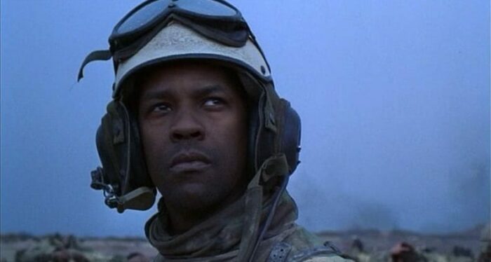 In this image from Courage Under Fire, Col. Nat Serling (Denzel Washington), dressed in combat fatigues and a helmet with goggles, looks to the sky.