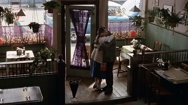 In this image from dogfight, the characters of Rose and Eddie are depicted embracing in Rose's cafe in 1969.
