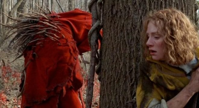 A blind Ivy (Bryce Dallas Howard) tries to evade a red-cloaked monster in the woods outside of her village.