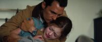 Cooper cradles his distraught daughter Murph (Interstellar)