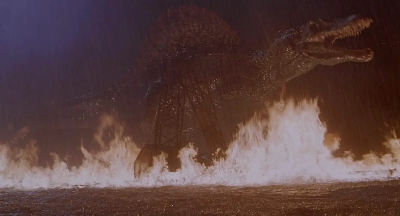 Spinosaurus walks in a lake that is on fire in jurassic park 3