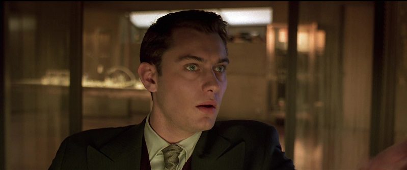 In this image from Gattaca, the character Jerome Morrow (played by Jude Law) is depicted in close-up gazing to the right.
