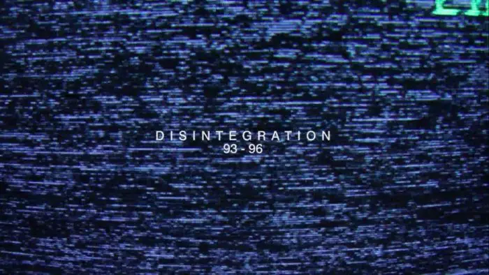Screenshot from Disintegration 93-96. The film's title is overlaid on tv static.
