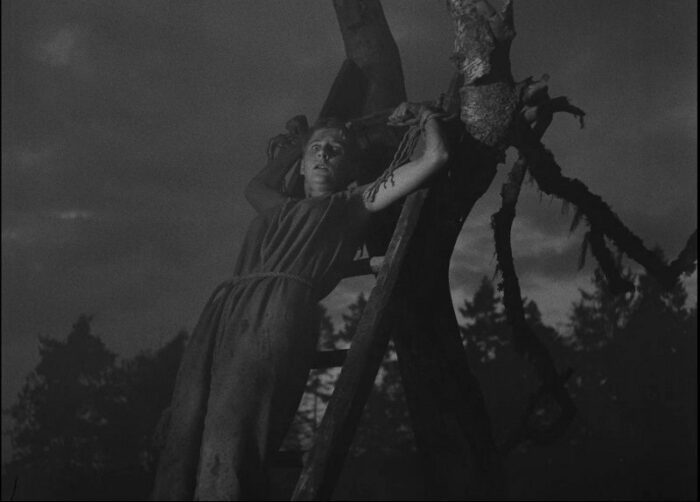 In this image from The Seventh Seal, a suspected witch (Maud Hansson) is depicted being burned on a pyre.