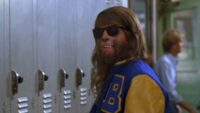Scott, as the wolf, in a letterman jacket and sunglasses