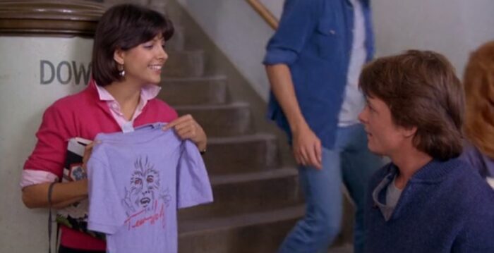 Scott and Boob talking, Boof holds up a Teen Wolf shirt.