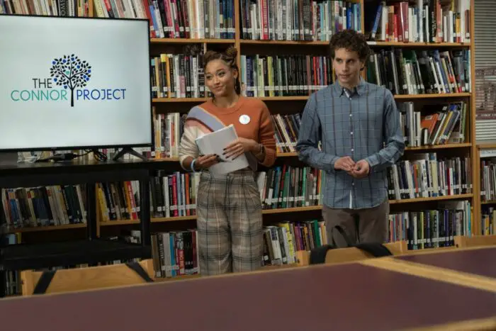 Two students are leading a presentation in a library