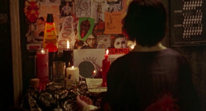 Nancy sits in front of her altar in an early scene of The Craft.