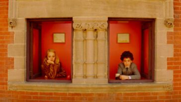 Margot and Chas Tenenbaum look out the window.