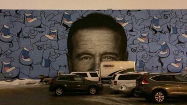 A Chicago mural features Robin Williams surrounding by his "Aladdin" genie character.