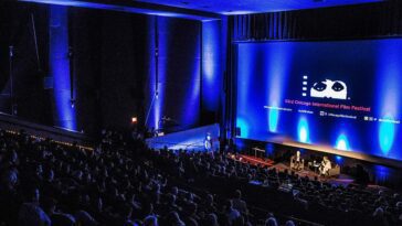 A crowded theater hosts a special event at the Chicago International Film Festival