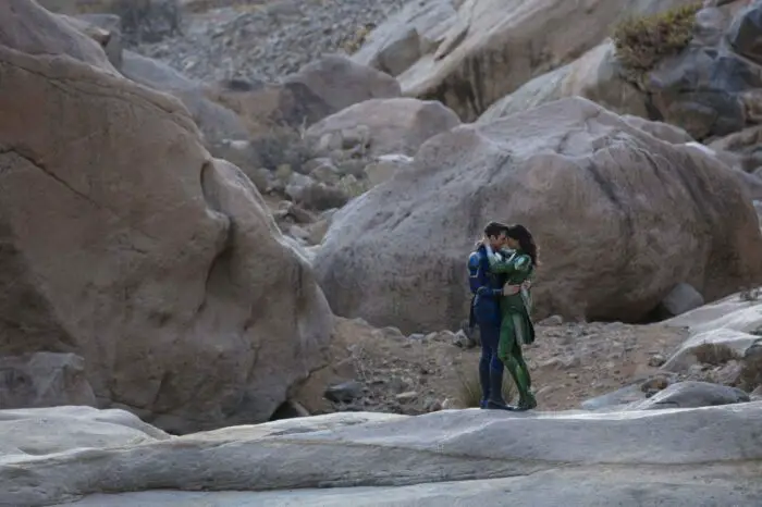 Ikaris and Sersi share an embrace in a rocky valley.