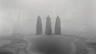 The three witches standing in the fog