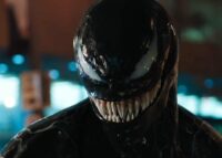 Venom flaunts his long and sharp teeth on the street.
