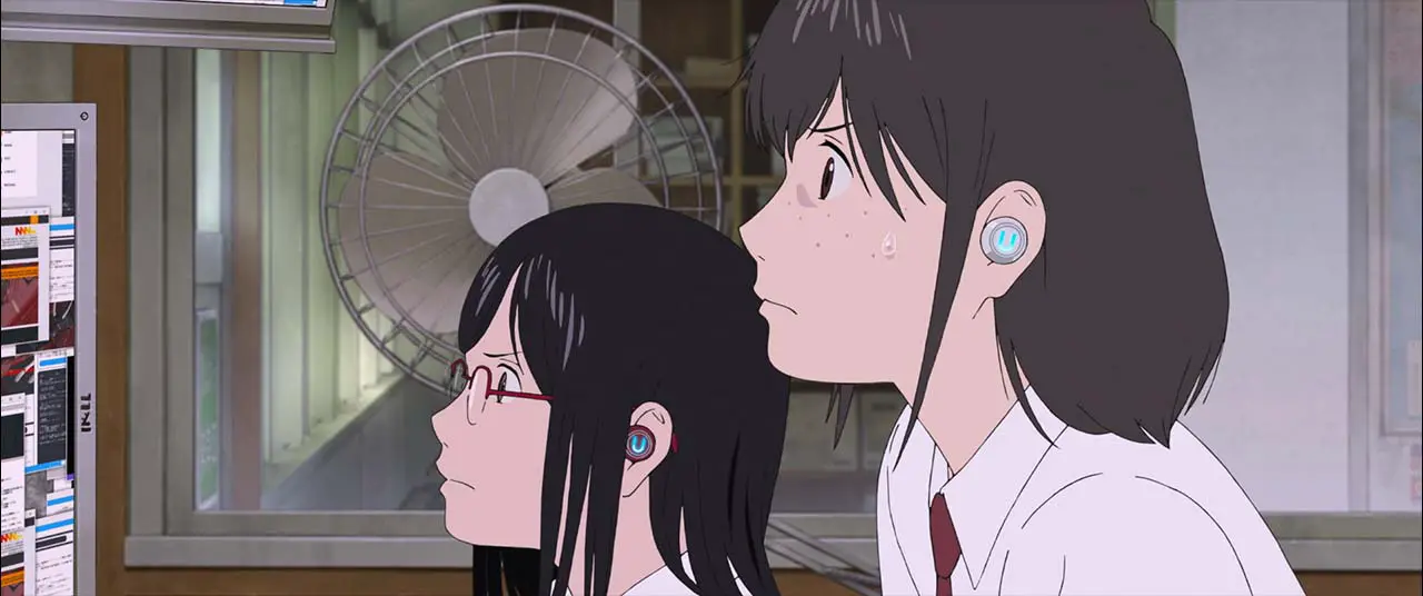 Image from Belle: Suzu and her friend both stare at the computer screen interface.