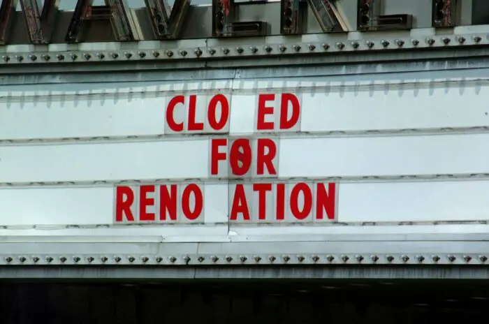 A theater marquee shows it closed for renovations