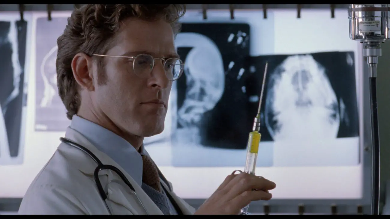 Sam's doctor holding up a filled syringe