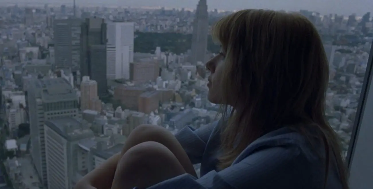 Charlotte looks out onto Tokyo in Lost In Translation