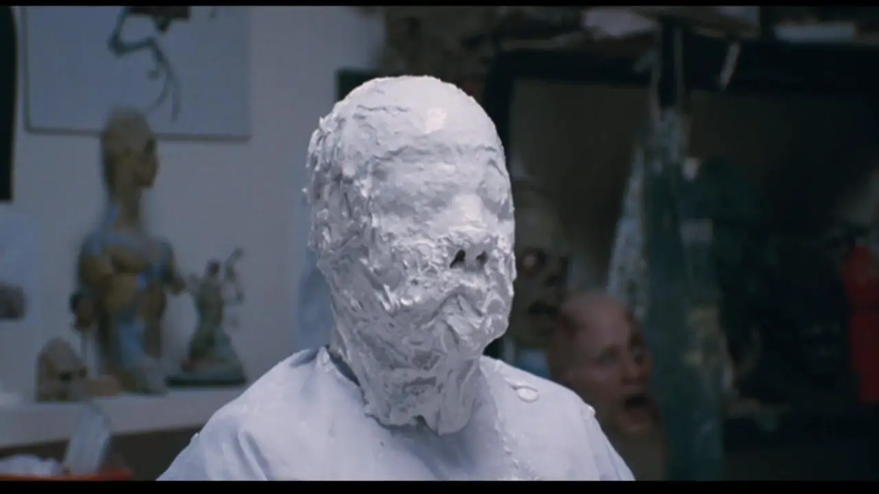 Image from Somewhere: Johnny wears a full-face plaster cast.