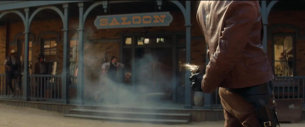 Image from Once Upon a Time... in Hollywood: Johnny Madrid (Timothy Olyphant) guns down Business Bob with a behind-the-back shot.
