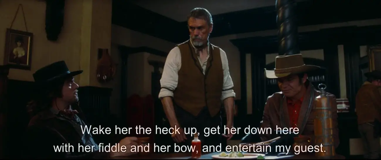 Image from Once Upon a Time... in Hollywood: Caleb tells the barkeep "Wake her the heck up, get her down here with her fiddle and her bow, and entertain my guest!”