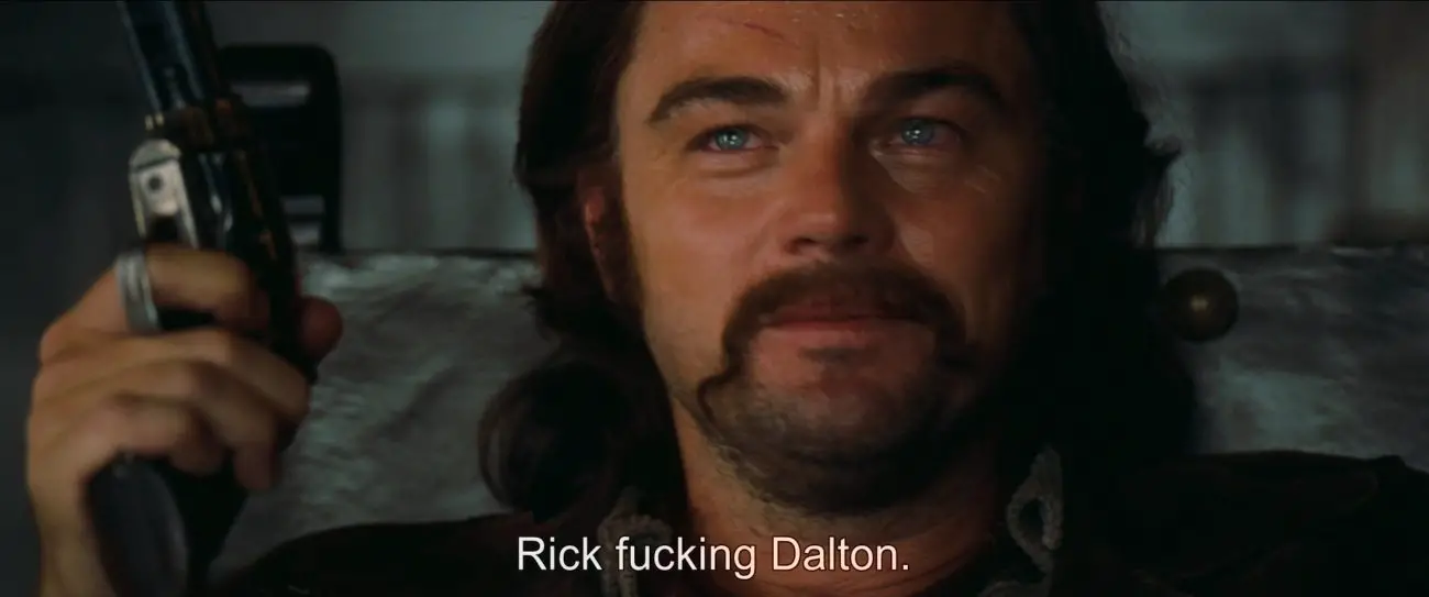 Image from Once Upon a Time... in Hollywood: As Caleb, Rick raises his gun and says "Rick F*ckin' Dalton."