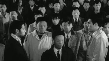 Image from The Face of Another: A crowd of people without faces