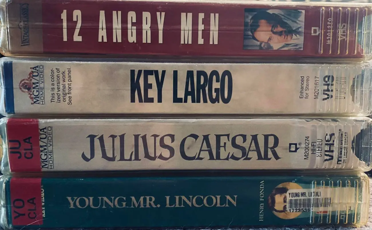 Stacked VHS tapes of 12 Angry Men, Key Largo, Julius Caesar and Young Mr. Lincoln