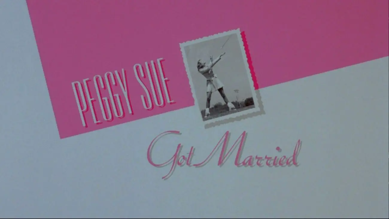 Title card of Peggy Sue Got Married featuring a black and white photo of a cheerleader.