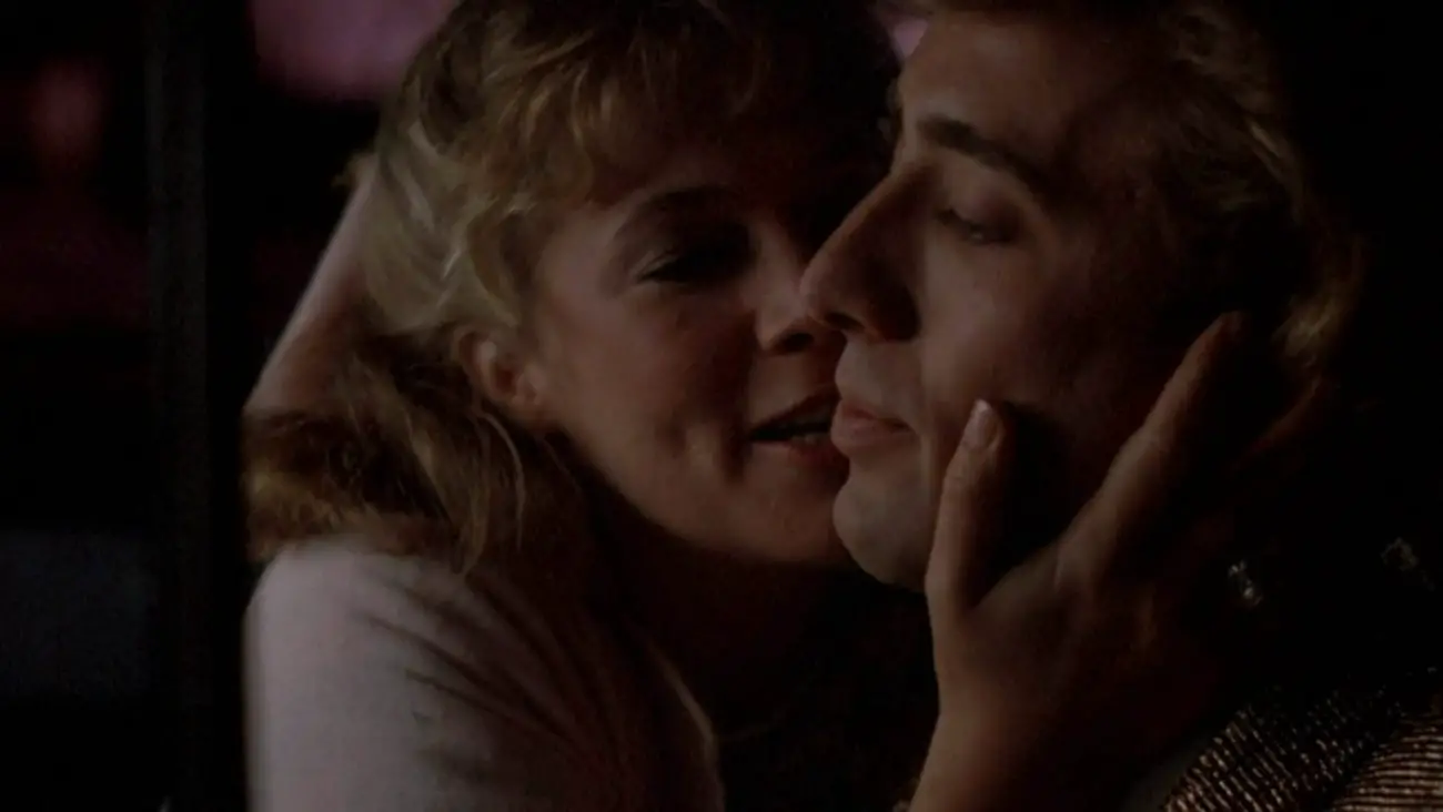Kathleen Turner and Nicholas Cage embrace in Peggy Sue Got Married