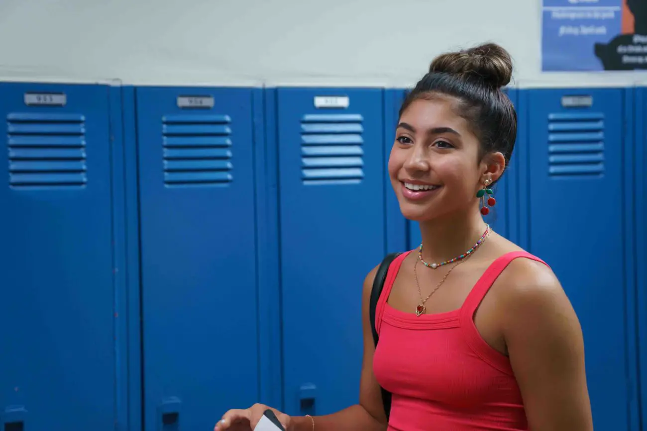 Gabriella smiling by lockers