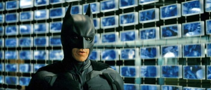 Batman, standing in front of the wall of screens from the sonar machine