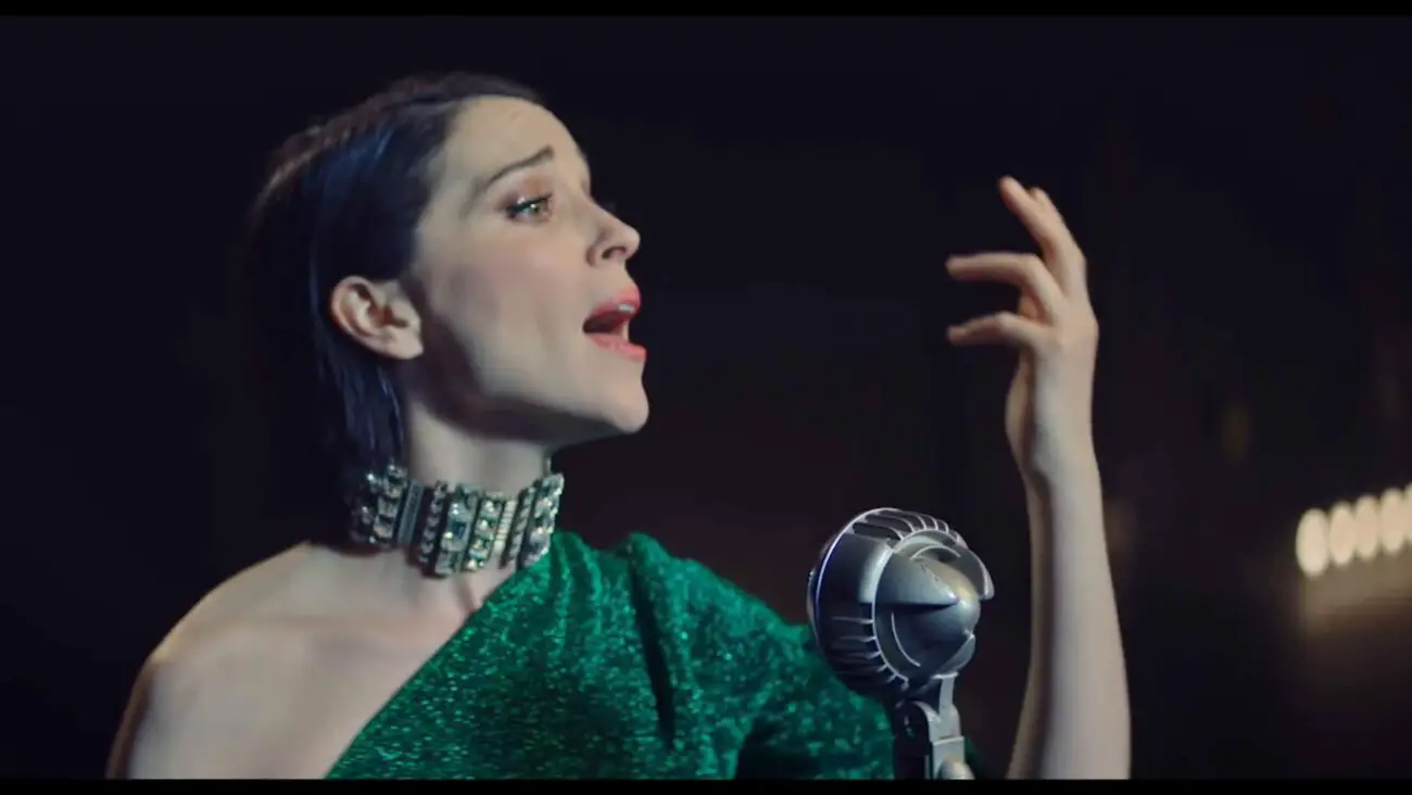 Annie Clark sings into microphone