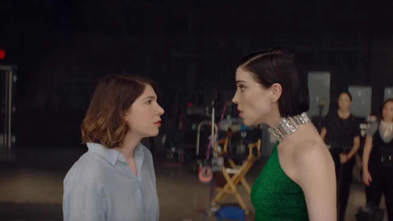 Carrie Brownstein and Annie Clark look at each other