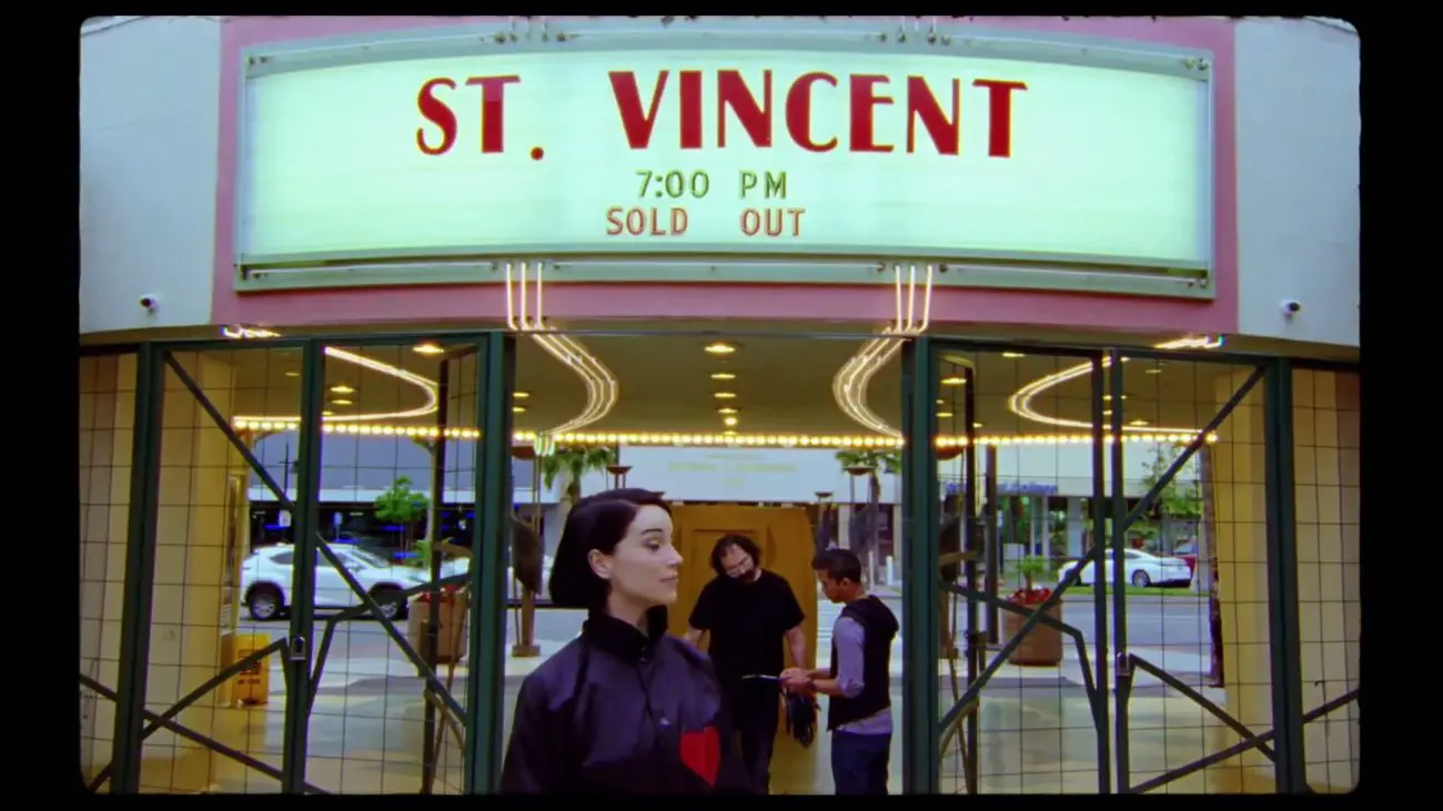 Annie Clark stands under marquee that reads, "St. Vincent 7pm Sold Out"