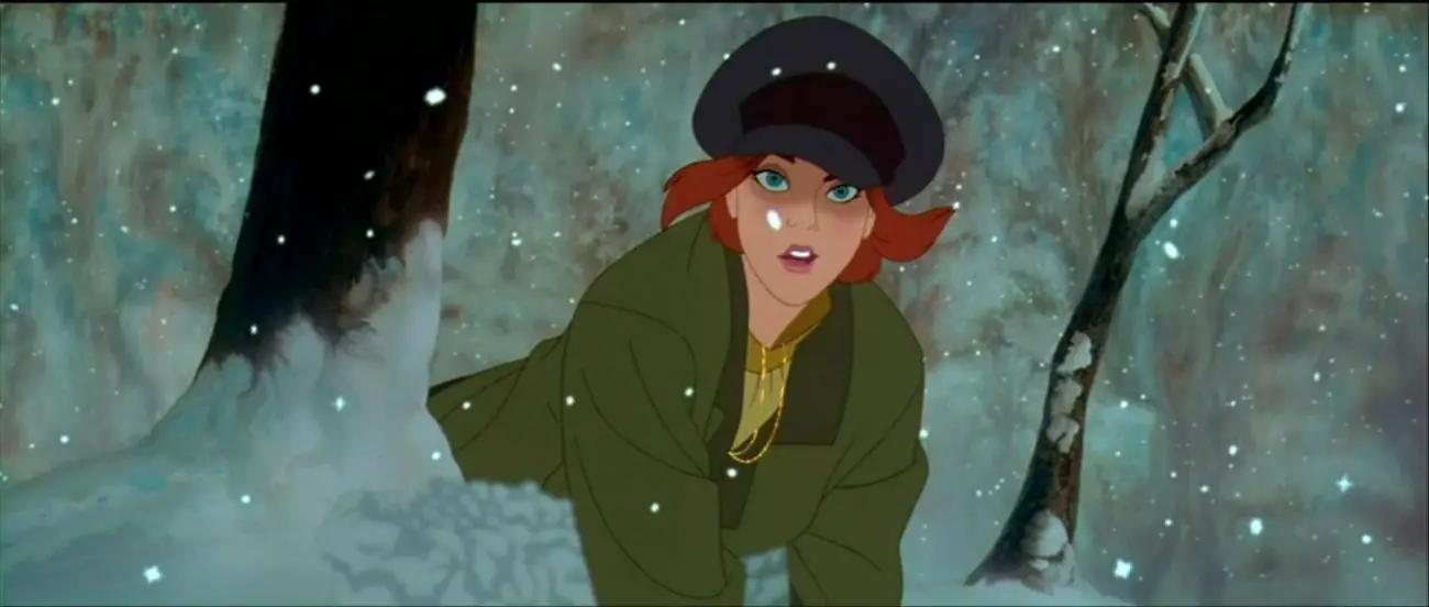 Image from Anastasia: Ana, wearing a cap, looks up from the snow