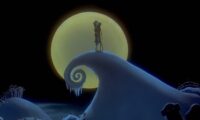 Jack and Sally embrace atop the iconic hill from The Nightmare Before Christmas