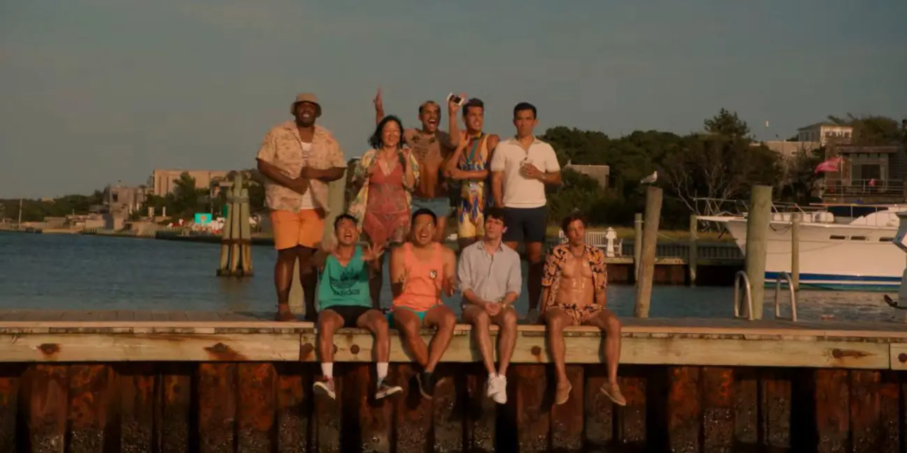 Noah, Howie, Luke, Keegan, Max, Erin, Charlie, and Will sit on the dock
