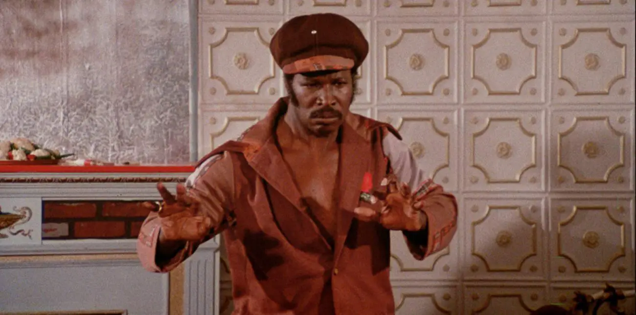 Dolemite holds out his hands