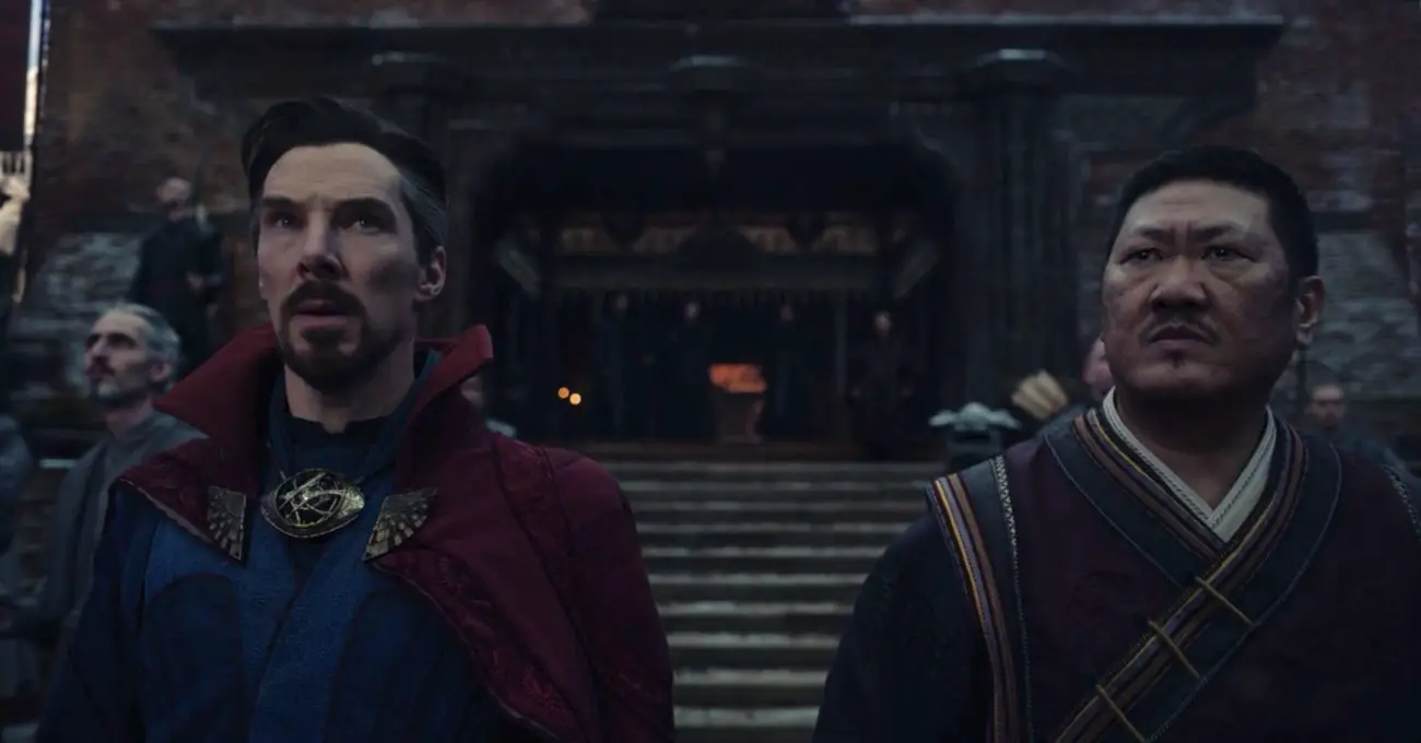 Stephen Strange and Wong (Benedict Wong) standing side-by-side at Kamar-Taj, looking apprehensively at the sky