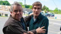 Patton Oswalt and James Morosini embrace in I LOVE MY DAD