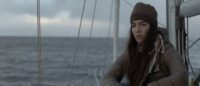 Dom (Dominique Braun) on a sailing boat in Get Away If You Can