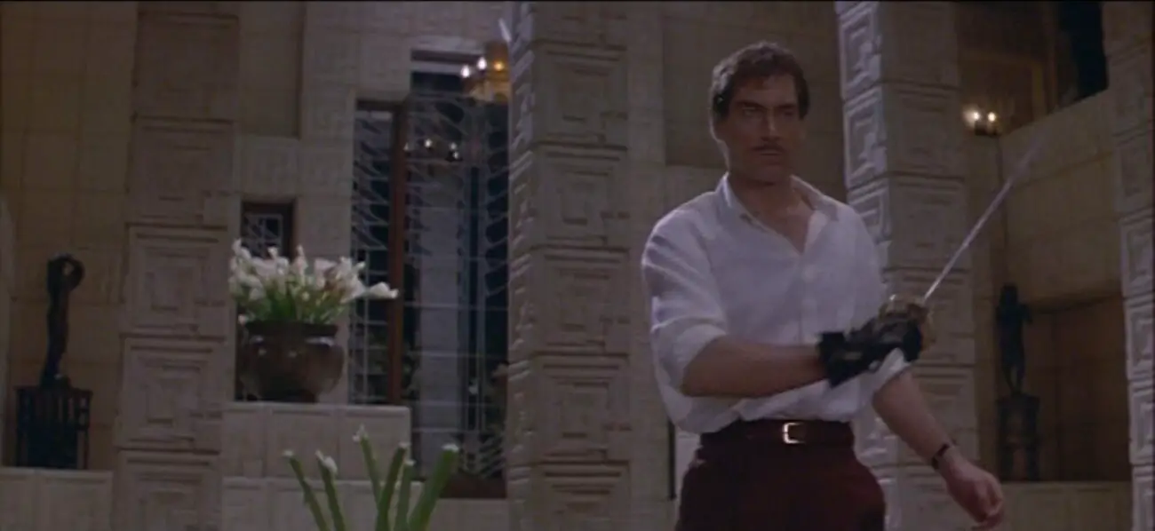 Image from The Rocketeer: Timothy Dalton holding a fencing sword as Neville Sinclair 