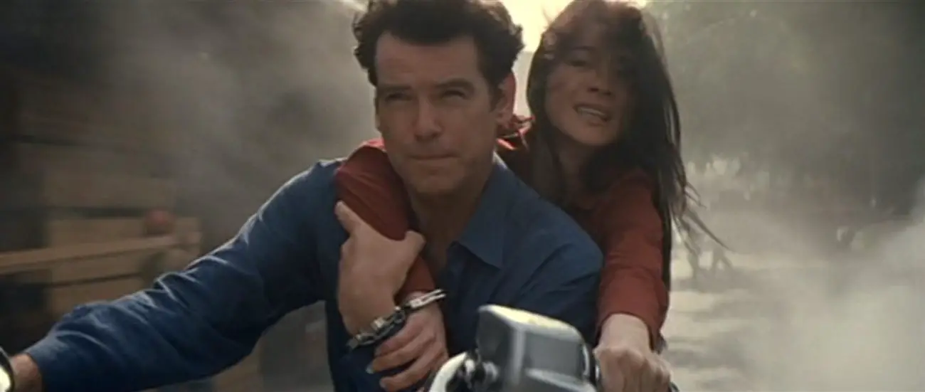 Pierce Brosnan handcuffed to Michelle Yeoh on a speeding motorcycle in Tomorrow Never Dies (1997)