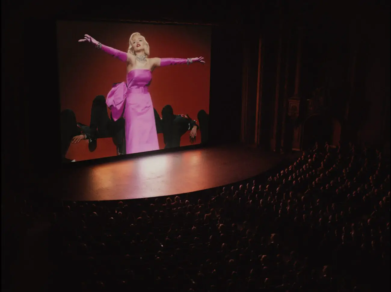 A scene from "Gentlemen Prefer Blondes" on screen at a movie theatre