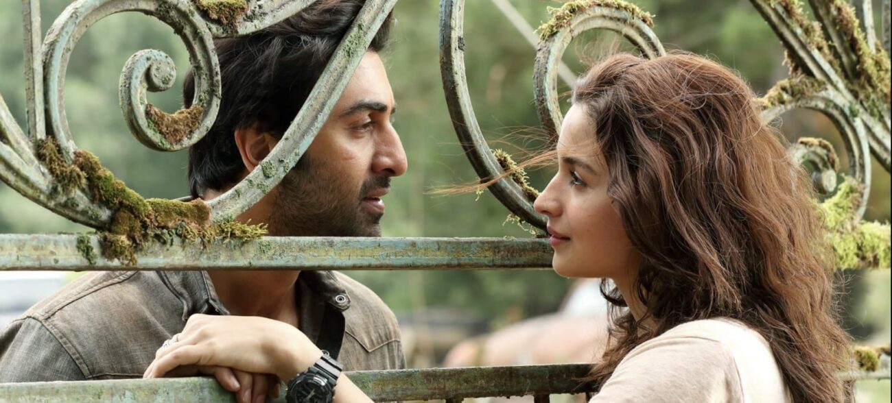 Shiva (Kapoor) and Isha (Bhatt) share a romantic moment at a gate.